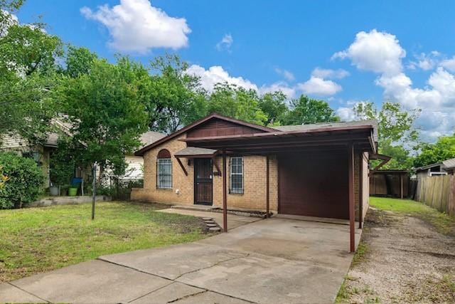 3406 Schwartz Ave, Fort Worth, TX 76106 - ranch-style house featuring concrete driveway, a carport, and brick siding