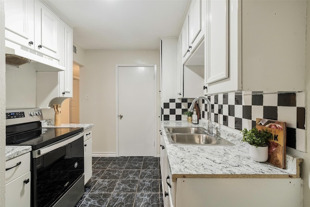 3406 Schwartz Ave, Fort Worth, TX 76106 - kitchen featuring stainless steel range with electric stovetop, a sink, under cabinet range hood, and light countertops