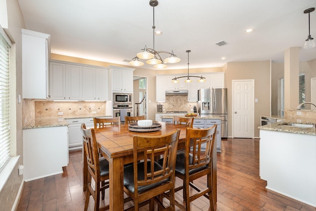 2916 Woods Dr, Plano, TX 75025 - dining space featuring dark wood-type flooring, recessed lighting, and baseboards