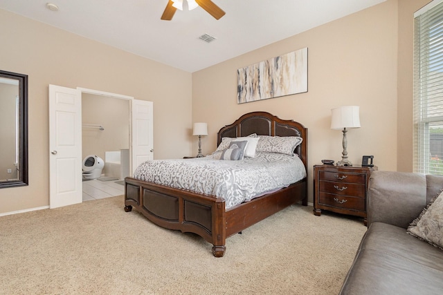 2916 Woods Dr, Plano, TX 75025 - bedroom with light colored carpet, connected bathroom, ceiling fan, and baseboards