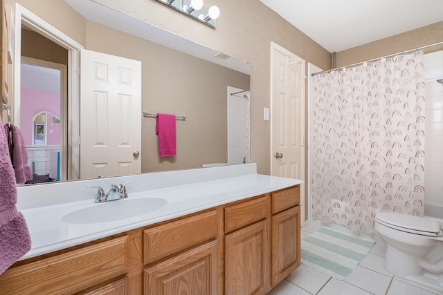 2916 Woods Dr, Plano, TX 75025 - bathroom featuring toilet, tile patterned flooring, and vanity