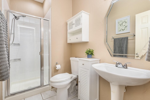 2916 Woods Dr, Plano, TX 75025 - bathroom with toilet, a stall shower, and tile patterned floors