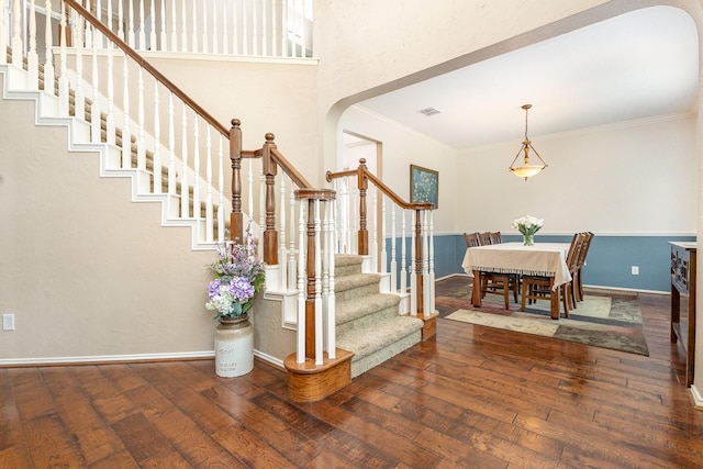 2916 Woods Dr, Plano, TX 75025 - foyer featuring arched walkways, stairs, hardwood / wood-style flooring, crown molding, and baseboards