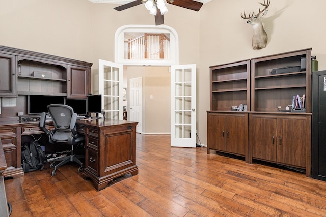 2916 Woods Dr, Plano, TX 75025 - office area with french doors, a high ceiling, ceiling fan, and wood finished floors