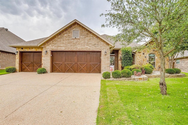 1017 Thistle Hill Trl, Weatherford, TX 76087 - view of front facade with an attached garage, a front yard, brick siding, and driveway