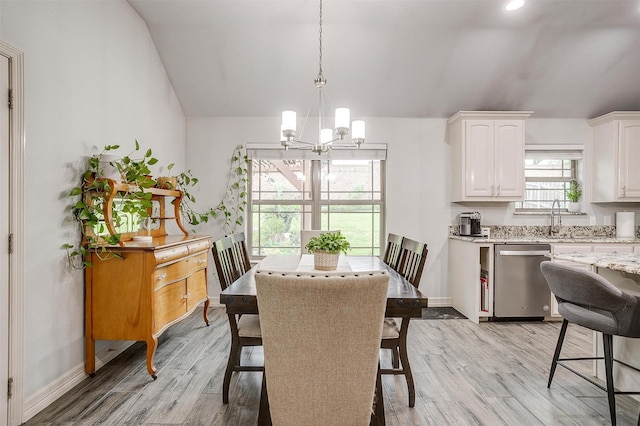 1017 Thistle Hill Trl, Weatherford, TX 76087 - dining space featuring a chandelier, lofted ceiling, light wood-style flooring, and baseboards