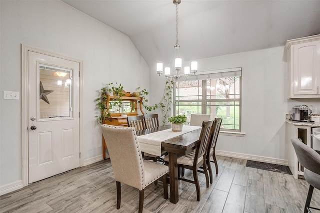 1017 Thistle Hill Trl, Weatherford, TX 76087 - dining room featuring a chandelier, light wood-style flooring, lofted ceiling, and baseboards