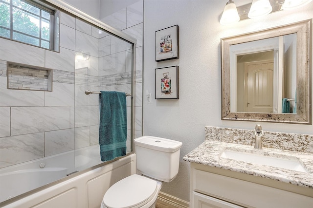 1017 Thistle Hill Trl, Weatherford, TX 76087 - full bathroom featuring vanity, combined bath / shower with glass door, and toilet