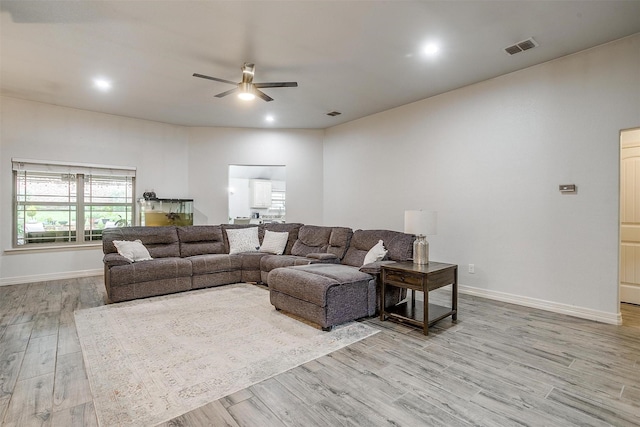 1017 Thistle Hill Trl, Weatherford, TX 76087 - living room featuring wood finished floors, ceiling fan, baseboards, and recessed lighting