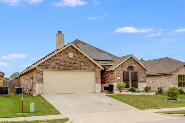 318 Green Meadows Rd, Wilmer, TX 75172 - view of front of house featuring a chimney, brick siding, a garage, and concrete driveway