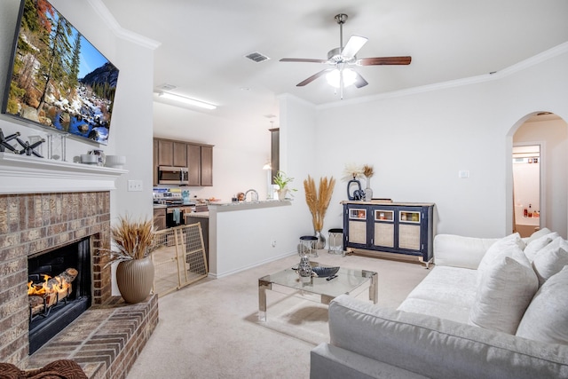 318 Green Meadows Rd, Wilmer, TX 75172 - living room with light colored carpet, arched walkways, ceiling fan, crown molding, and a brick fireplace