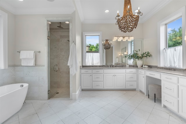 6644 Josephine St, Plano, TX 75024 - full bath featuring a chandelier, a shower stall, vanity, a freestanding tub, and crown molding