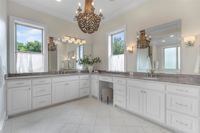 6644 Josephine St, Plano, TX 75024 - bathroom featuring a chandelier, double vanity, ornamental molding, and tile patterned flooring