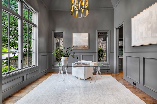 6644 Josephine St, Plano, TX 75024 - home office featuring a decorative wall, ornamental molding, a chandelier, wood finished floors, and a wainscoted wall