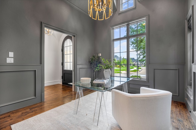 6644 Josephine St, Plano, TX 75024 - home office with a chandelier, a decorative wall, dark wood finished floors, a wainscoted wall, and ornamental molding