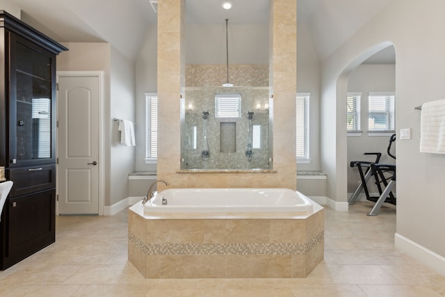 508 Cascade Springs Dr, Southlake, TX 76092 - bathroom featuring a bath, healthy amount of natural light, tile patterned flooring, baseboards, and lofted ceiling