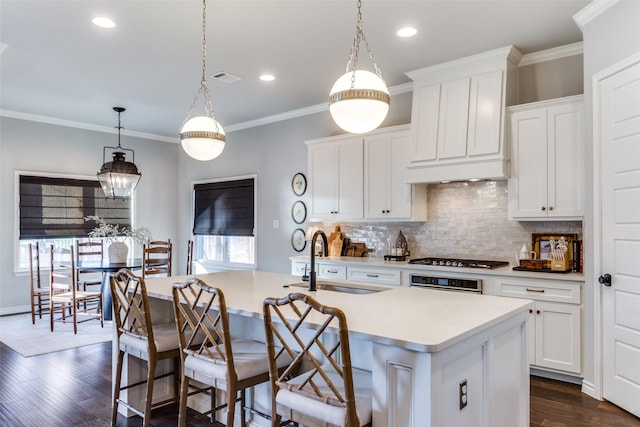 712 Tallgrass Dr, Aledo, TX 76008 - kitchen with a sink, light countertops, wall oven, decorative backsplash, and a kitchen island with sink