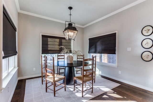 712 Tallgrass Dr, Aledo, TX 76008 - dining room with wood finished floors, crown molding, baseboards, and a chandelier