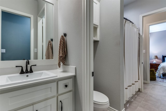 712 Tallgrass Dr, Aledo, TX 76008 - full bath featuring toilet, vanity, ensuite bathroom, tile patterned flooring, and a textured wall