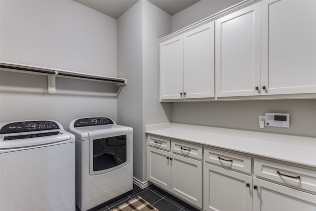 712 Tallgrass Dr, Aledo, TX 76008 - laundry area with cabinet space, washing machine and clothes dryer, and dark tile patterned floors