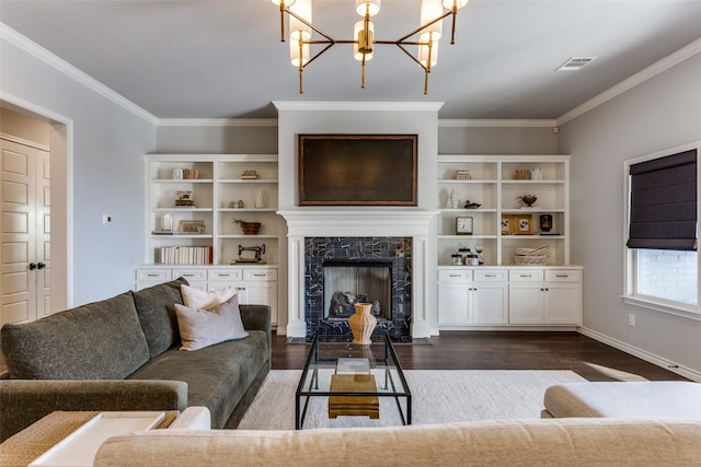 712 Tallgrass Dr, Aledo, TX 76008 - living area with ornamental molding, dark wood finished floors, a chandelier, a high end fireplace, and baseboards