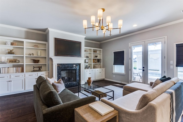 712 Tallgrass Dr, Aledo, TX 76008 - living area featuring dark wood-style floors, a chandelier, a fireplace, french doors, and ornamental molding