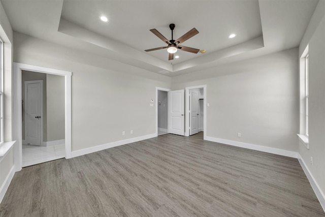 498 Cumberland Trl, Bridgeport, TX 76458 - unfurnished bedroom with a raised ceiling, wood finished floors, recessed lighting, baseboards, and ceiling fan