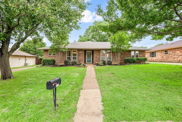 7529 Mapleleaf Dr, North Richland Hills, TX 76182 - ranch-style home featuring a front lawn and brick siding