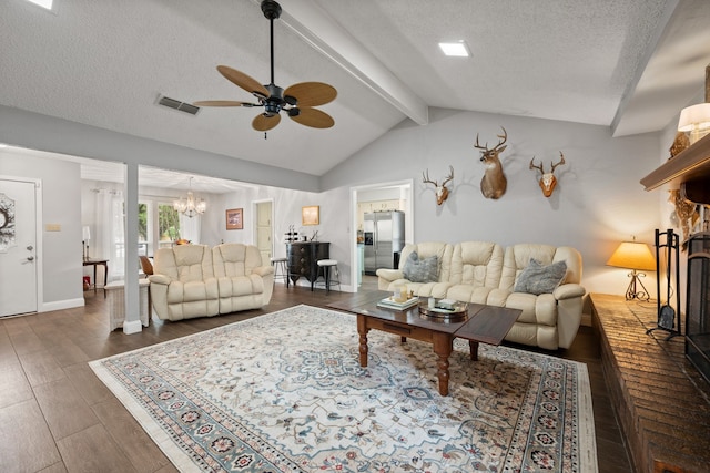 7529 Mapleleaf Dr, North Richland Hills, TX 76182 - living room with ceiling fan, a chandelier, a textured ceiling, wood finished floors, and a brick fireplace