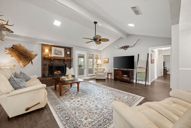 7529 Mapleleaf Dr, North Richland Hills, TX 76182 - living room with a fireplace, ceiling fan, dark wood-style floors, a textured ceiling, and baseboards