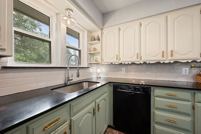 7529 Mapleleaf Dr, North Richland Hills, TX 76182 - kitchen with black dishwasher, green cabinetry, a sink, dark countertops, and backsplash