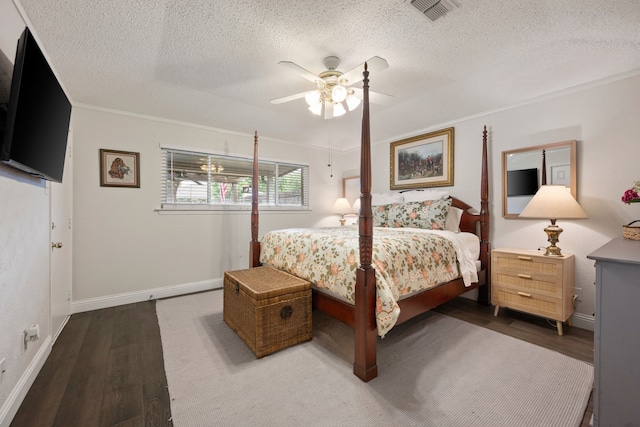7529 Mapleleaf Dr, North Richland Hills, TX 76182 - bedroom featuring wood finished floors, a textured ceiling, a ceiling fan, baseboards, and crown molding