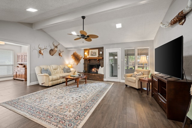 7529 Mapleleaf Dr, North Richland Hills, TX 76182 - living room featuring a fireplace, dark wood-style flooring, ceiling fan, and a textured ceiling