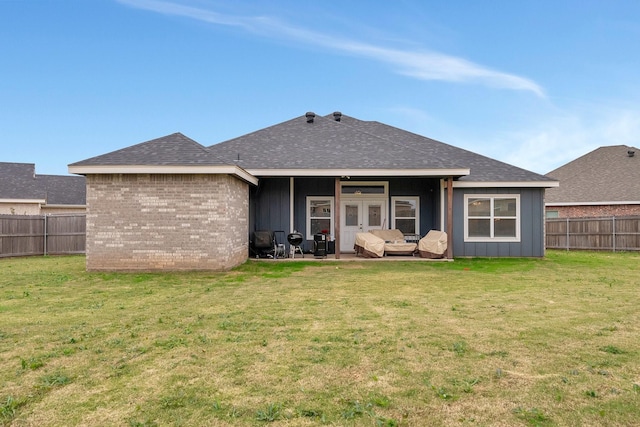 138 Lake Ridge Ct, Abilene, TX 79602 - rear view of house featuring board and batten siding, a shingled roof, brick siding, a patio area, and french doors