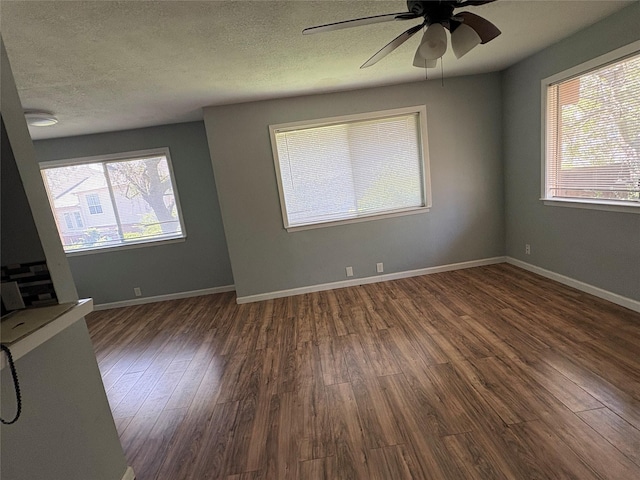 2804 W Walnut Hill Ln, Irving, TX 75038 - empty room featuring wood finished floors, healthy amount of natural light, ceiling fan, a textured ceiling, and baseboards