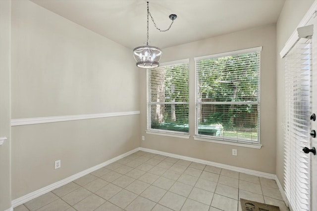 3412 Hofstra Dr, Denton, TX 76210 - unfurnished dining area featuring a chandelier and light tile patterned flooring