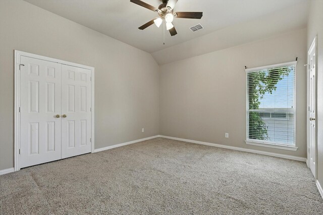 3412 Hofstra Dr, Denton, TX 76210 - unfurnished bedroom featuring carpet flooring, lofted ceiling, a closet, and a ceiling fan