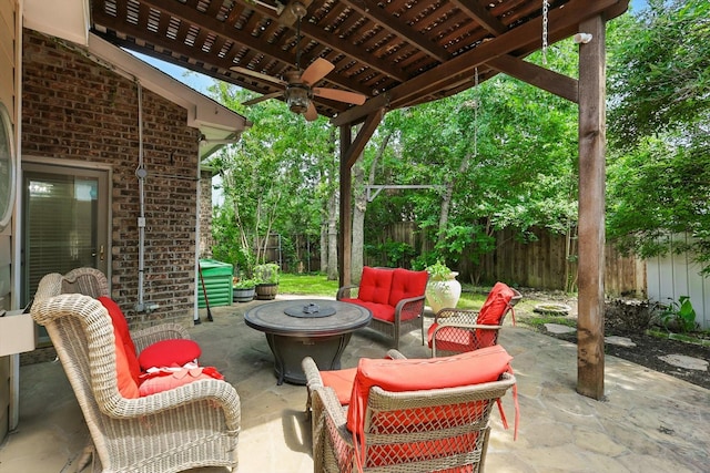 3412 Hofstra Dr, Denton, TX 76210 - fenced backyard featuring ceiling fan, a patio area, and an outdoor living space with a fire pit