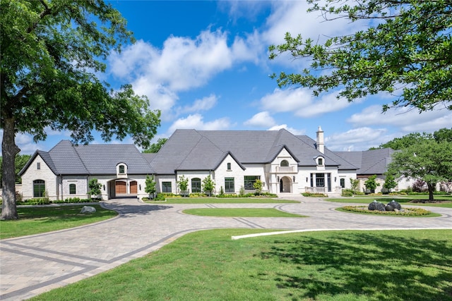 4905 Reserve Ct, Parker, TX 75002 - view of front of house with stone siding, curved driveway, and a front yard