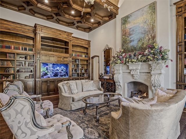 4905 Reserve Ct, Parker, TX 75002 - living room featuring coffered ceiling, a warm lit fireplace, wood finished floors, beam ceiling, and built in shelves