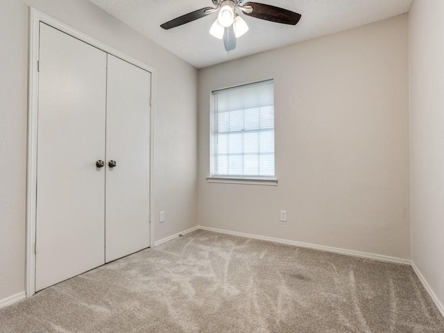 1810 Running River Rd, Garland, TX 75044 - unfurnished bedroom featuring carpet flooring, a closet, and ceiling fan