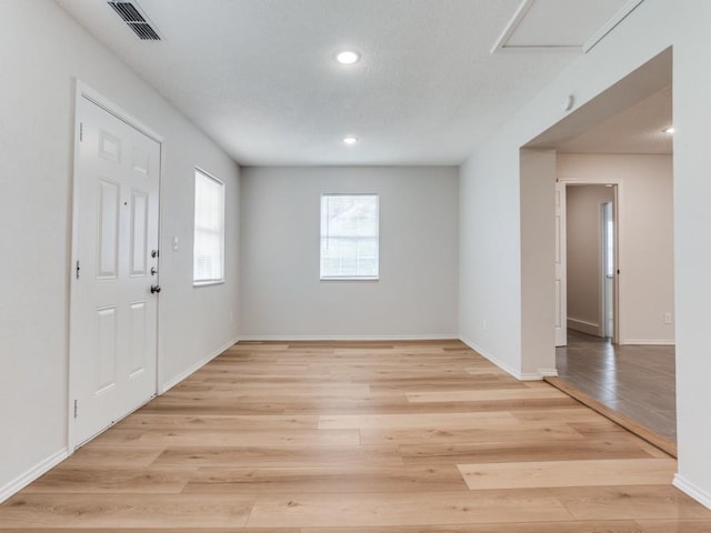 1810 Running River Rd, Garland, TX 75044 - entryway with light wood finished floors and recessed lighting