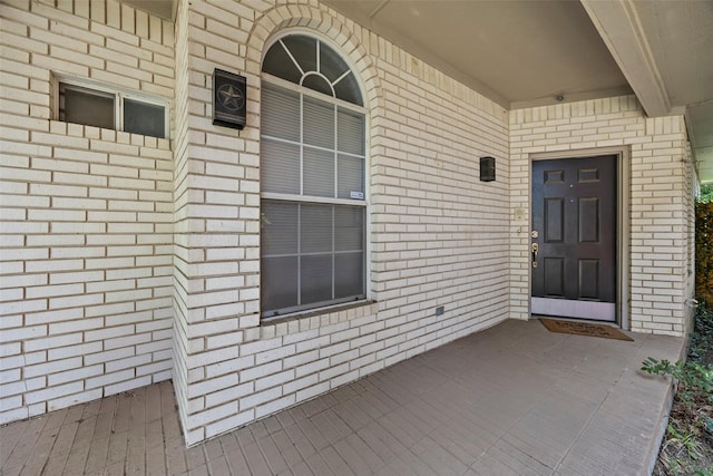 7421 Buckskin Ct, Fort Worth, TX 76137 - view of exterior entry featuring brick siding and a porch