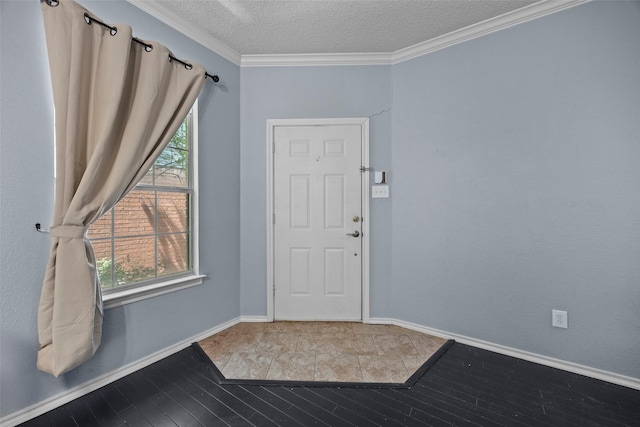 7421 Buckskin Ct, Fort Worth, TX 76137 - entrance foyer featuring wood finished floors, plenty of natural light, a textured ceiling, crown molding, and baseboards