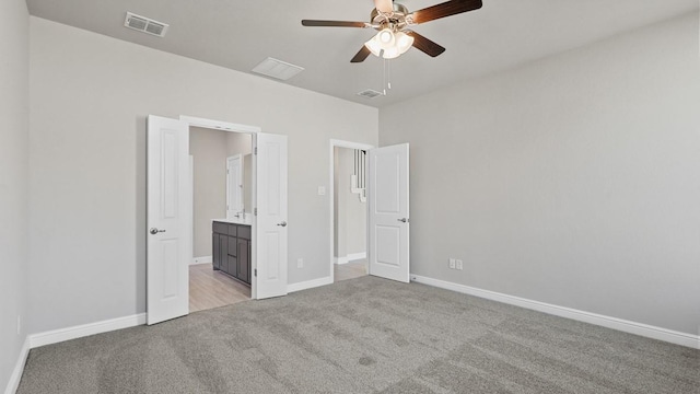 11213 Orchard Ln, Justin, TX 76247 - unfurnished bedroom featuring light colored carpet, baseboards, connected bathroom, and a ceiling fan