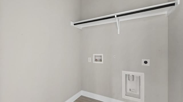 11213 Orchard Ln, Justin, TX 76247 - washroom with electric dryer hookup, hookup for a washing machine, gas dryer hookup, baseboards, and wood finished floors