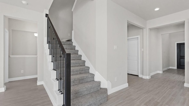11213 Orchard Ln, Justin, TX 76247 - staircase featuring baseboards, recessed lighting, and wood finished floors