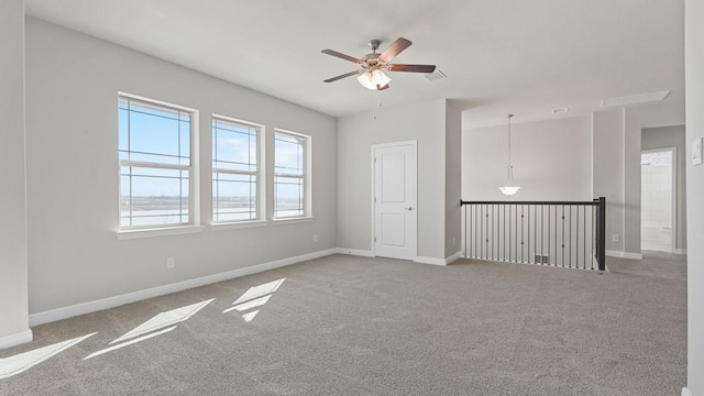 11213 Orchard Ln, Justin, TX 76247 - spare room featuring carpet floors, a ceiling fan, and baseboards