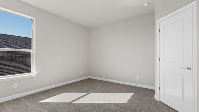 11213 Orchard Ln, Justin, TX 76247 - carpeted spare room with baseboards and a smoke detector