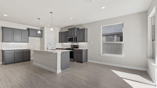 11213 Orchard Ln, Justin, TX 76247 - kitchen with appliances with stainless steel finishes, tasteful backsplash, baseboards, and recessed lighting